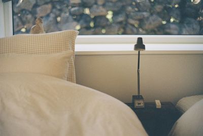 Close-up of chair on bed at home
