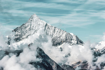 Snow covered mountain against sky