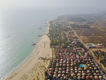 Aerial view of city by sea