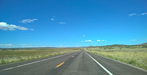 Empty road along landscape