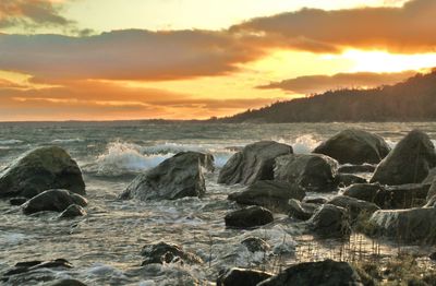 Scenic view of sea at sunset