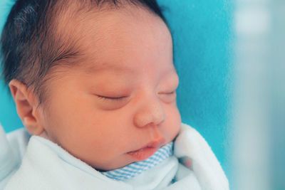 Close-up portrait of cute baby sleeping