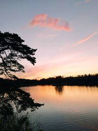 Scenic view of lake against sky during sunset