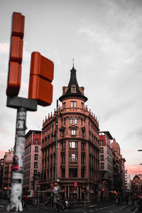 View of buildings against cloudy sky