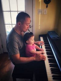 Mother and daughter playing at home