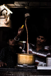 Portrait of man preparing food