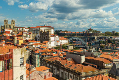 High angle view of buildings in city against sky