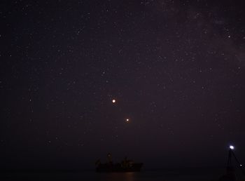 Scenic view of sea against sky at night