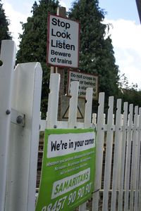 Close-up of information sign board against trees