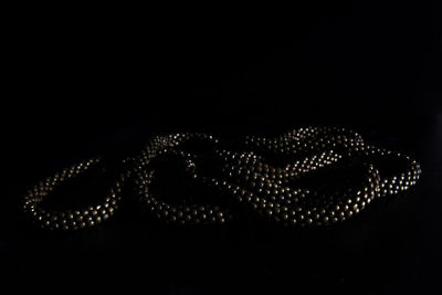 Close-up of illuminated text against black background