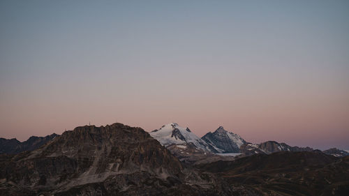 Scenic view of mountain against sky during sunrise