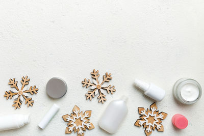 High angle view of pills spilling from bottle on table