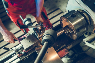 Midsection of man working in workshop