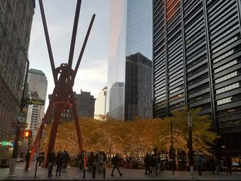 Panoramic view of skyscrapers in city against sky