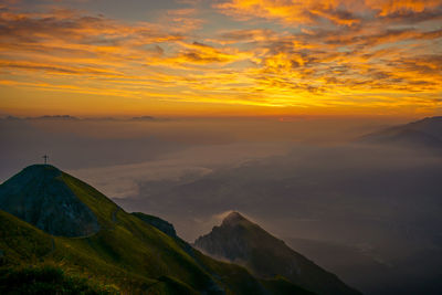 Scenic view of mountains against sky during sunset