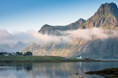 Scenic view of lake and mountains against sky