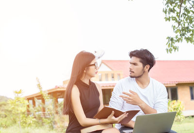 Young couple looking at camera