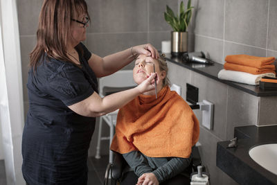 Woman having her make up done