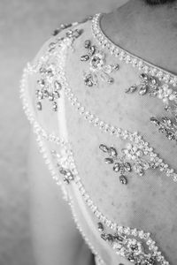 Midsection of bride wearing dress