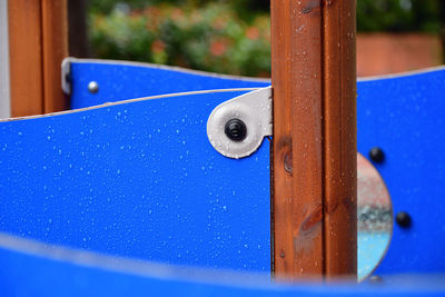 Close-up of water drop on wood at playground