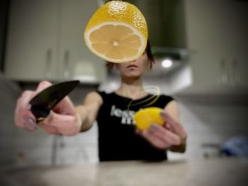 Lemon cut in half by a woman