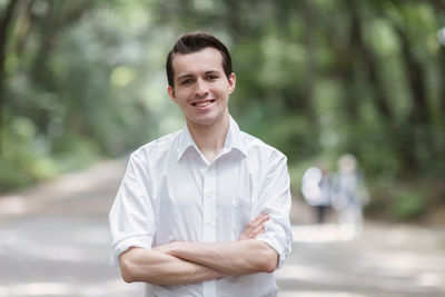 Portrait of young man standing outdoors