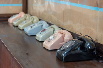 Close-up of vintage telephones on table
