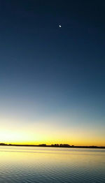 Scenic view of landscape against clear sky at night