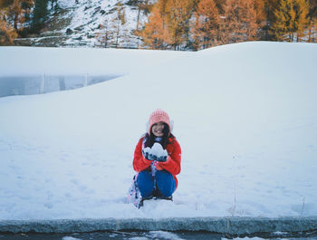 Portrait of boy on snow field during winter