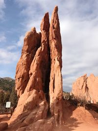 Low angle view of rock formation against sky