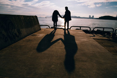 Silhouette people on beach