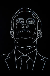 Close-up portrait of human face against black background
