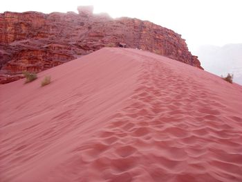 Rock formations in desert against sky