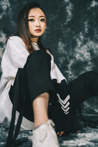 Portrait of a beautiful young woman standing outdoors