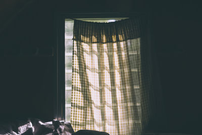 Low angle view of curtain hanging on window at home