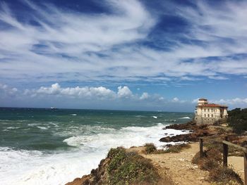 Scenic view of sea against cloudy sky
