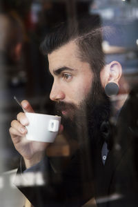 Hipster businessman on break for a coffee