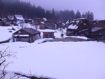 Snow covered houses on snow covered mountain