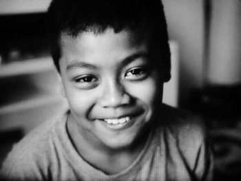 Portrait of smiling boy at home