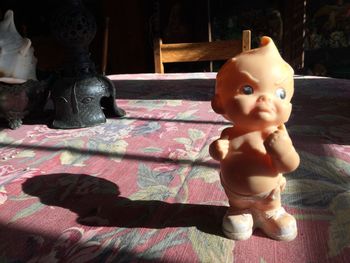 Close-up of baby statue at home