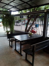 Empty chairs and table in building