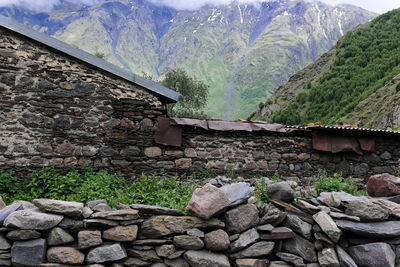 View of stone wall against mountain