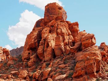 Low angle view of rock formation against sky