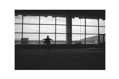 Silhouette of woman against clear sky