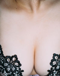 Close-up of woman against white background