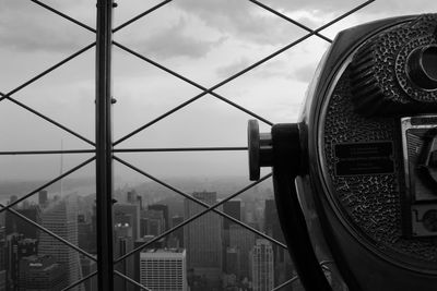 Close-up of cityscape against cloudy sky