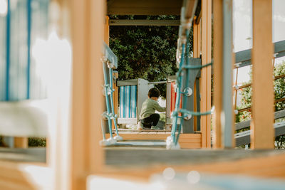 Woman looking through window
