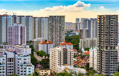 Buildings in city against sky