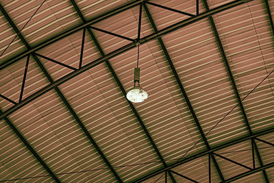 Low angle view of pendant lights hanging from ceiling