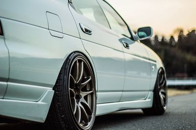 Cropped image of car parked on road